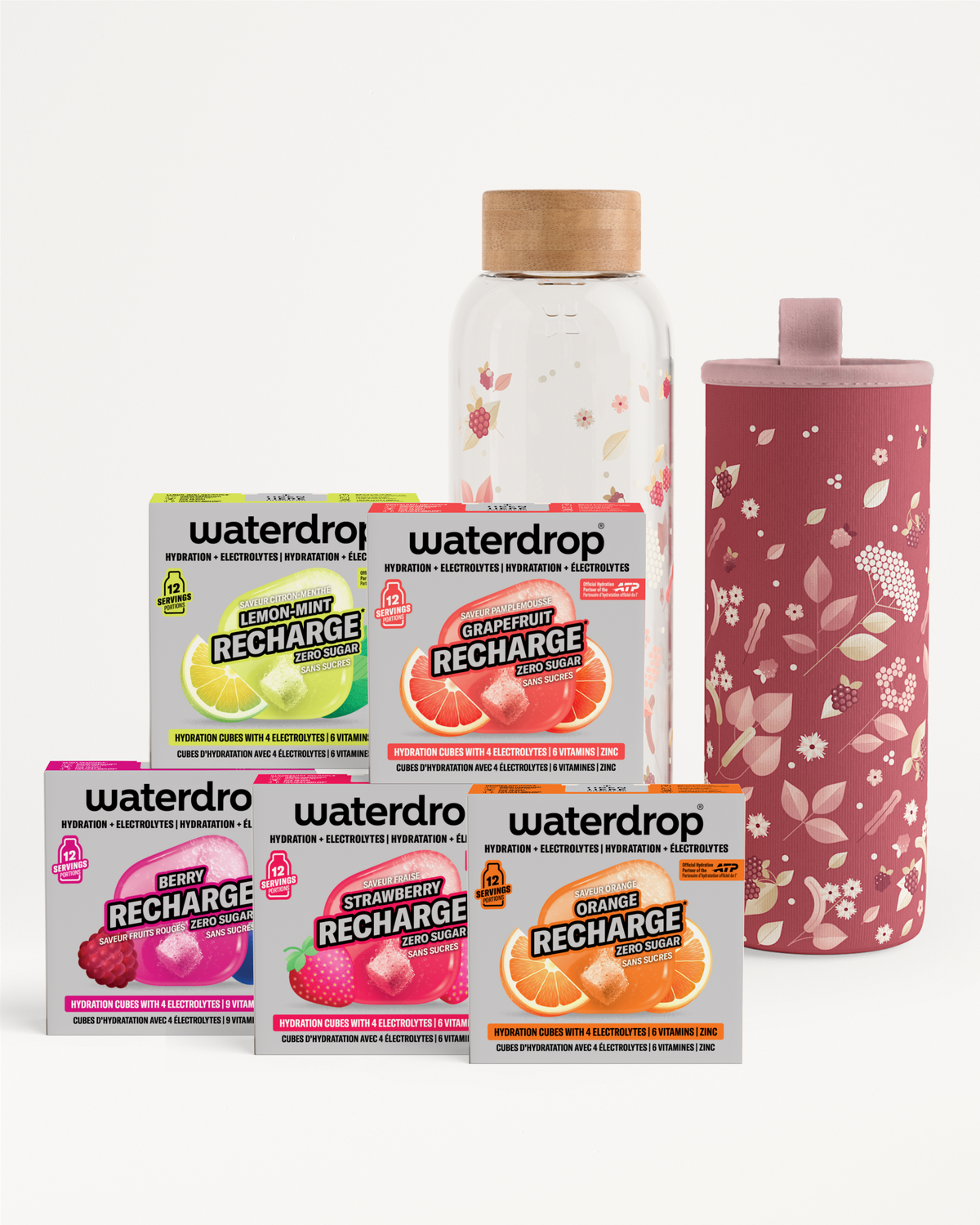 Confezioni assortite Waterdrop Recharge di sapori con una bottiglia di vetro e un bicchiere rosa a motivo floreale.