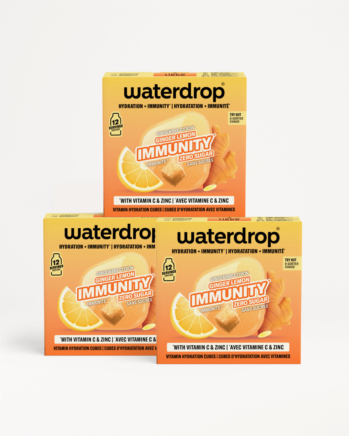 Tre confezioni arancioni Waterdrop Immunity con vitamina C e zinco impilate a piramide.