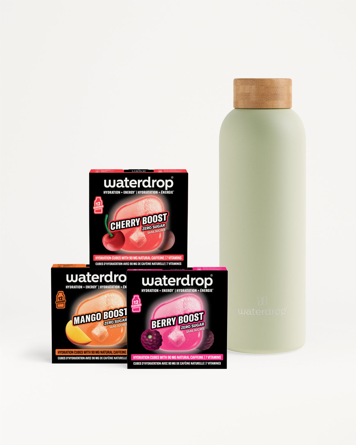 Tre confezioni Waterdrop booster (Cherry, Mango, Berry) accanto a una bottiglia verde chiaro con tappo in legno.