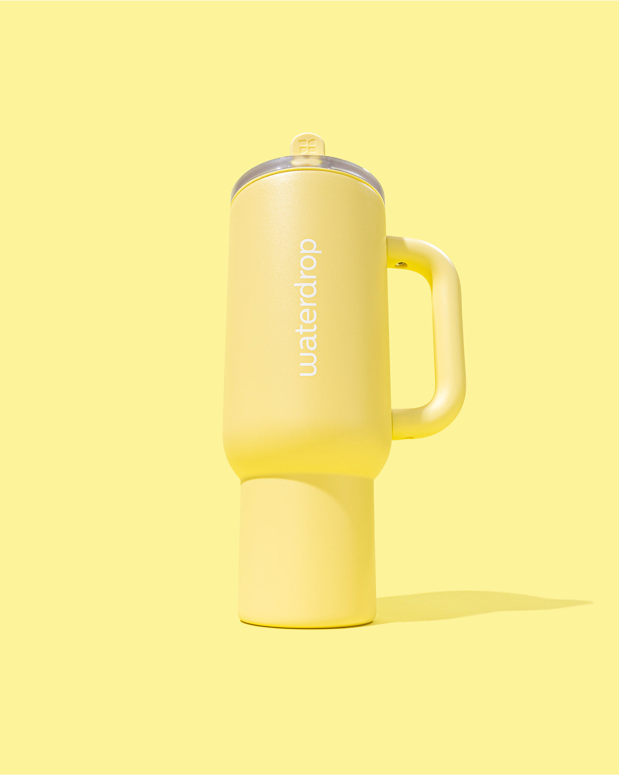 Tazza termica Explorer Butter Yellow con manico e coperchio flip-top.