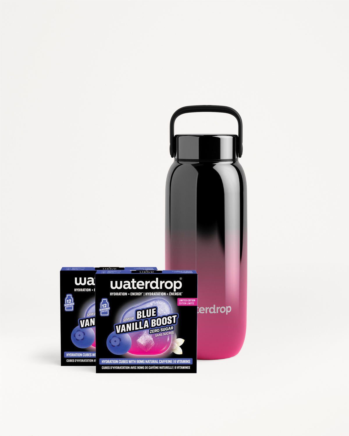 Bottiglia riutilizzabile con gradiente dal nero al rosa con manico accanto a un prodotto Waterdrop in confezione.