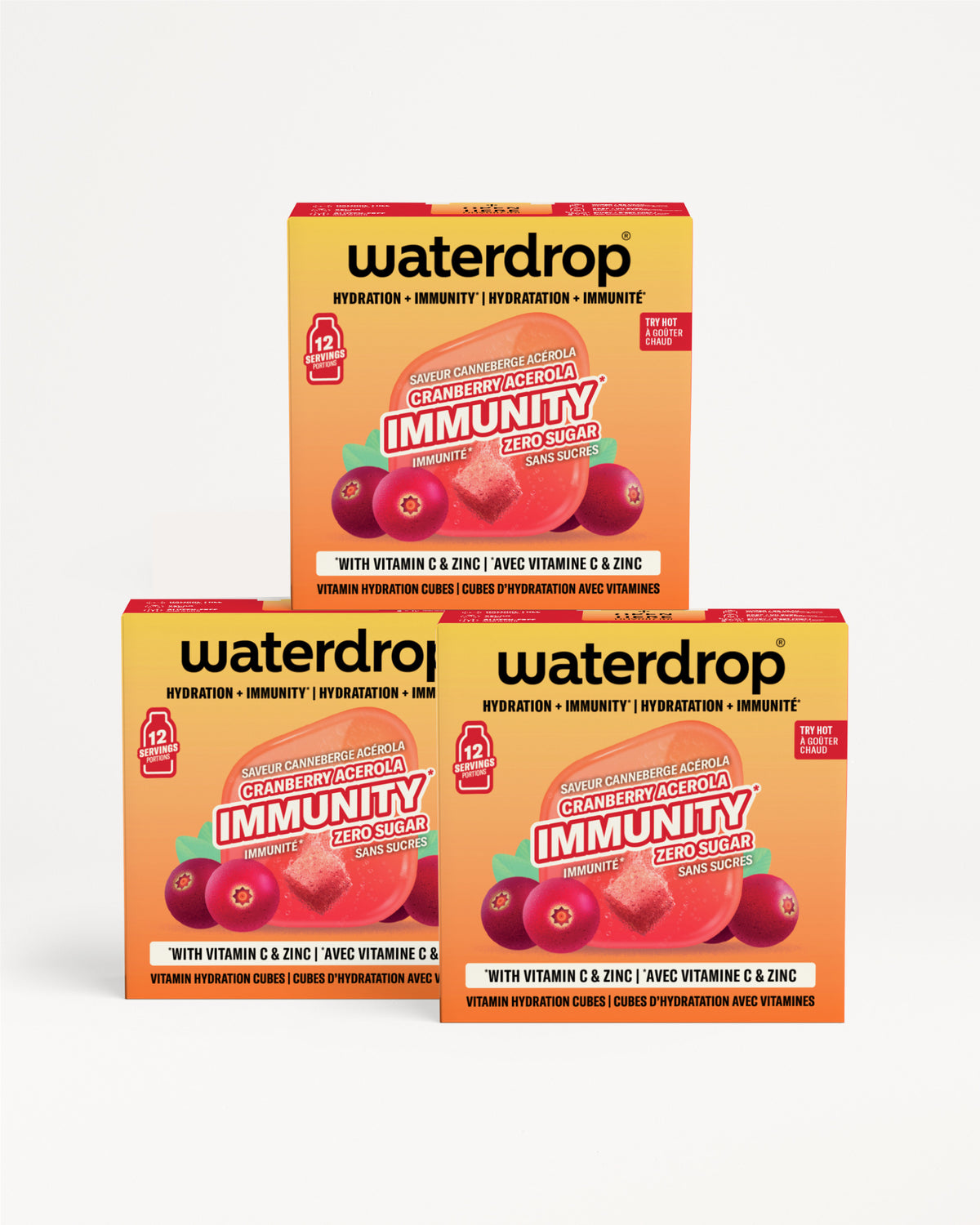 Tre scatole Waterdrop arancio-gialle impilate, con grafica di bacche.