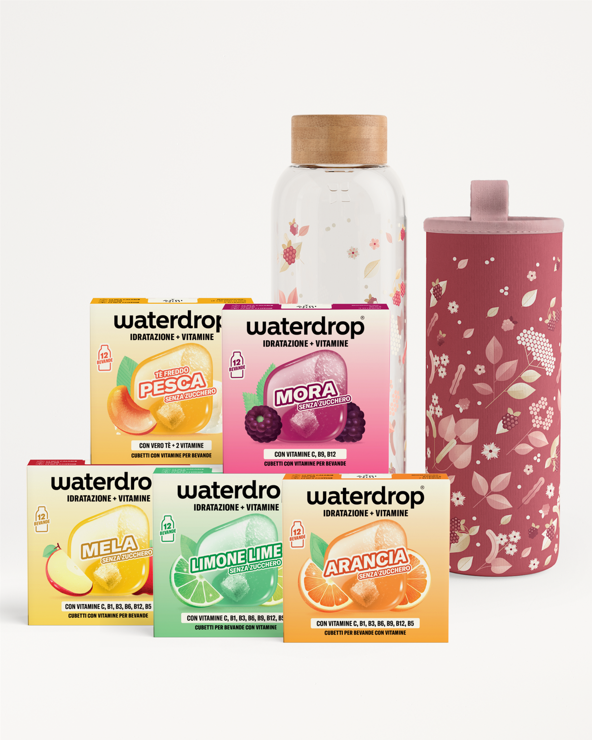 Scatole assortite di Waterdrop compresse per gusto, accompagnate da una bottiglia di vetro e una borraccia rosa.