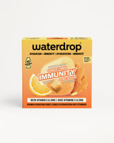 Scatola arancione Waterdrop immunità con limone e zenzero.