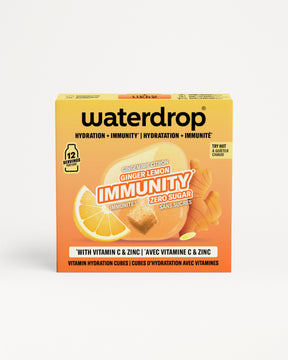 Scatola arancione Waterdrop immunità con limone e zenzero.