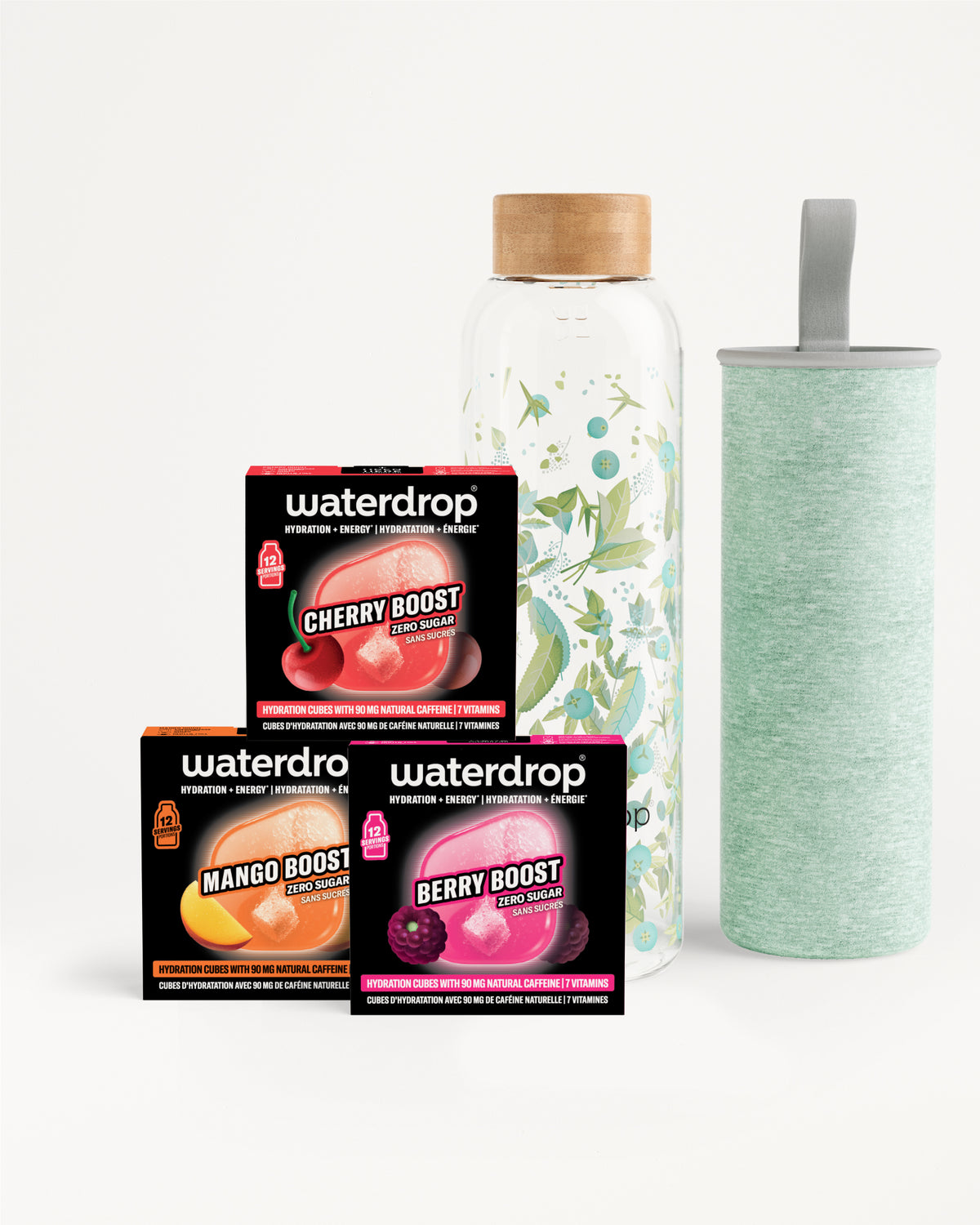 Set di tre confezioni Waterdrop Flavor Boost con una bottiglia in vetro con tappo in legno e un tumbler verde chiaro.