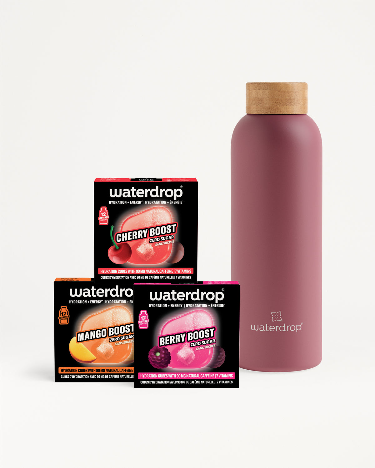 Tre confezioni compatte Waterdrop per booster di gusto accanto a una bottiglia rosa riutilizzabile con coperchio in legno.